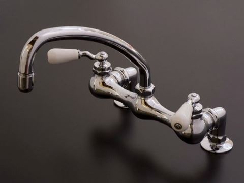 Strom Plumbing Deck Mount Kitchen Faucet with Arched Swivel Spout & Porcelain Lever Handles