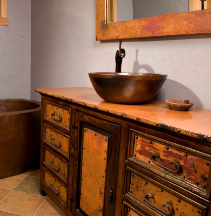 Wood and copper bath vanity with copper sink